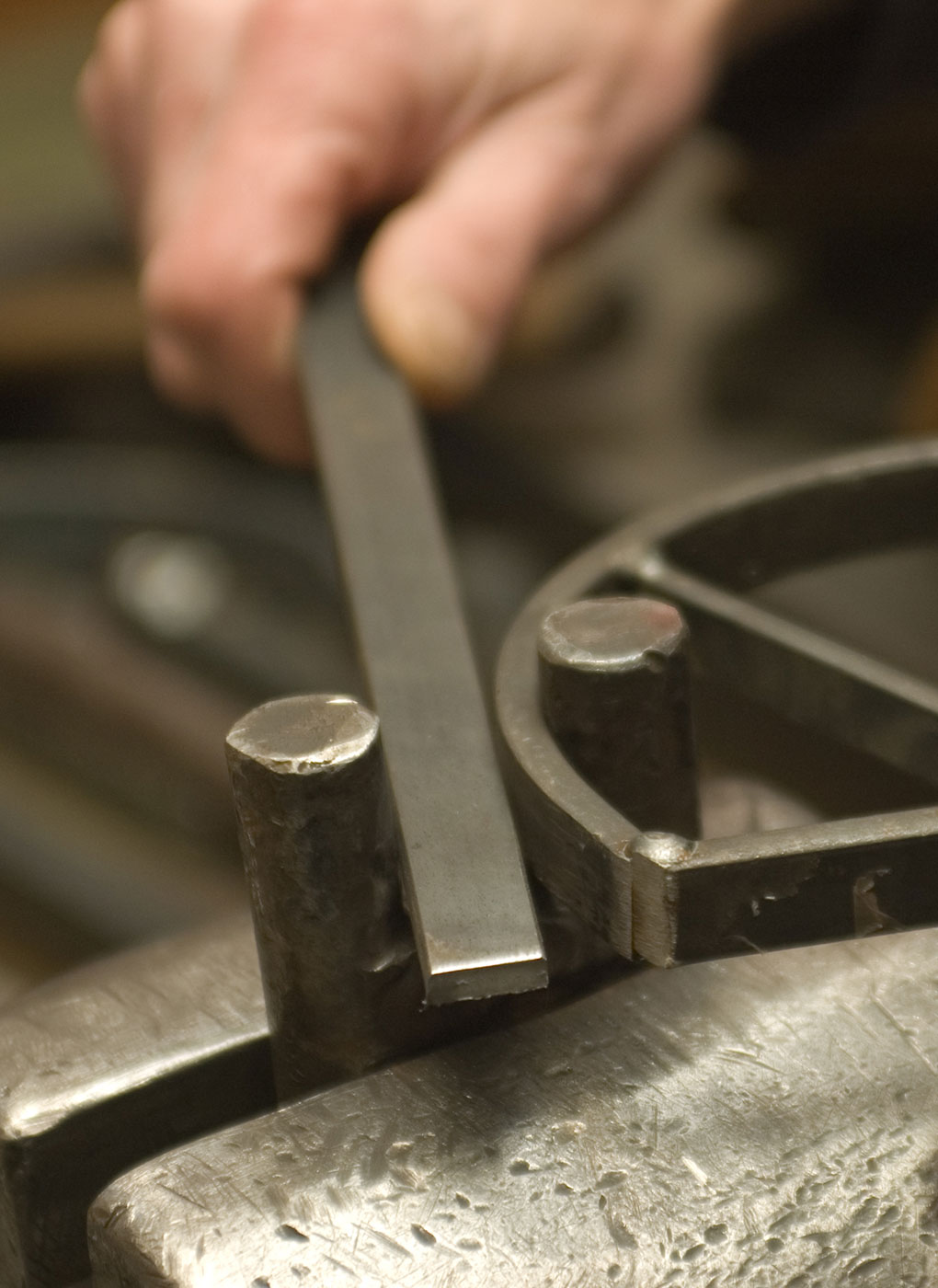 Bending of chandelier frame parts over a template