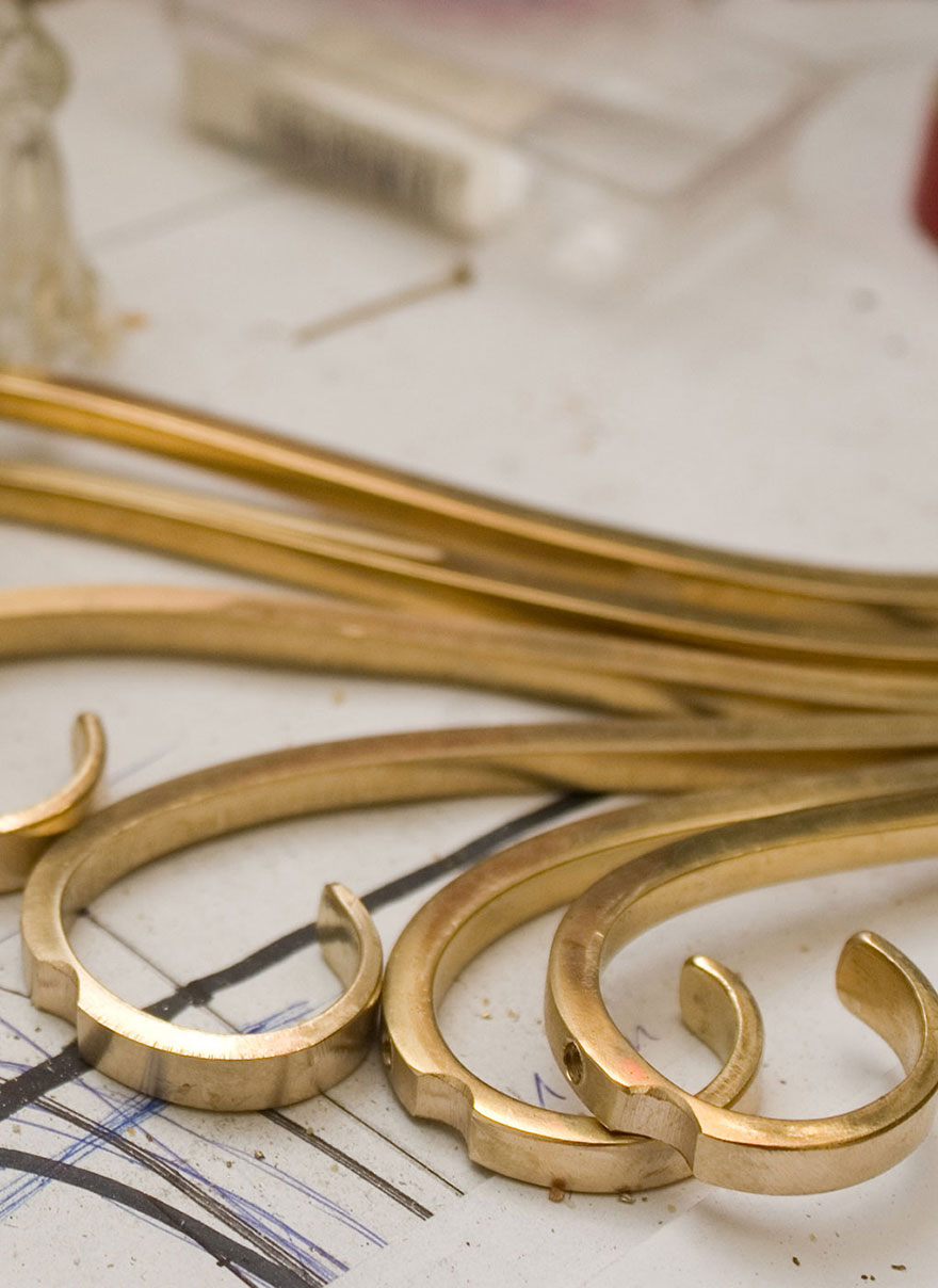 Satin polished brass parts of a candelabrum