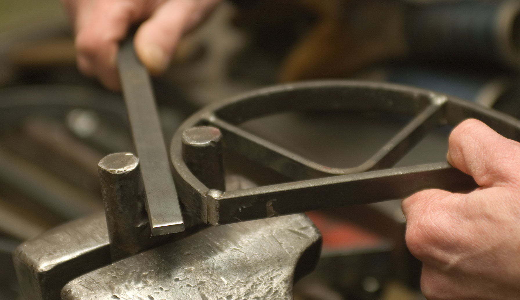 Ironsmith bending iron at LOBMEYR