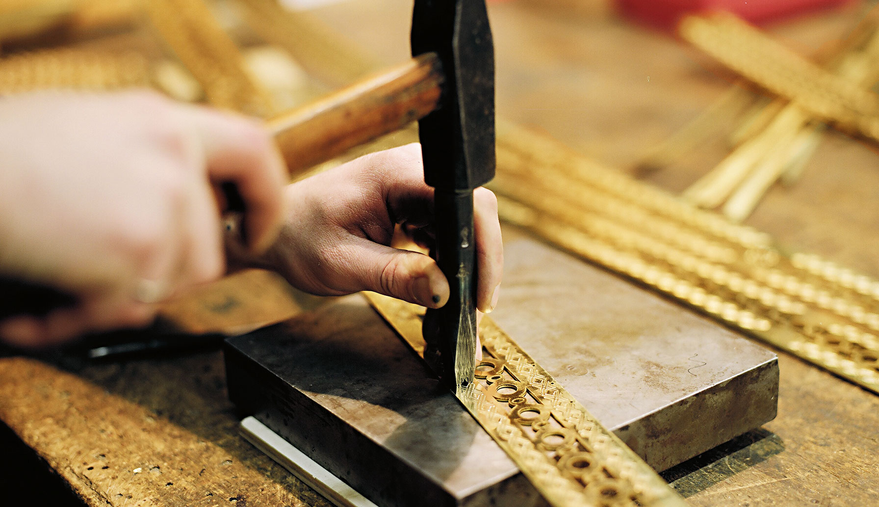 Embossing a chandelier's belt with a steel stamp