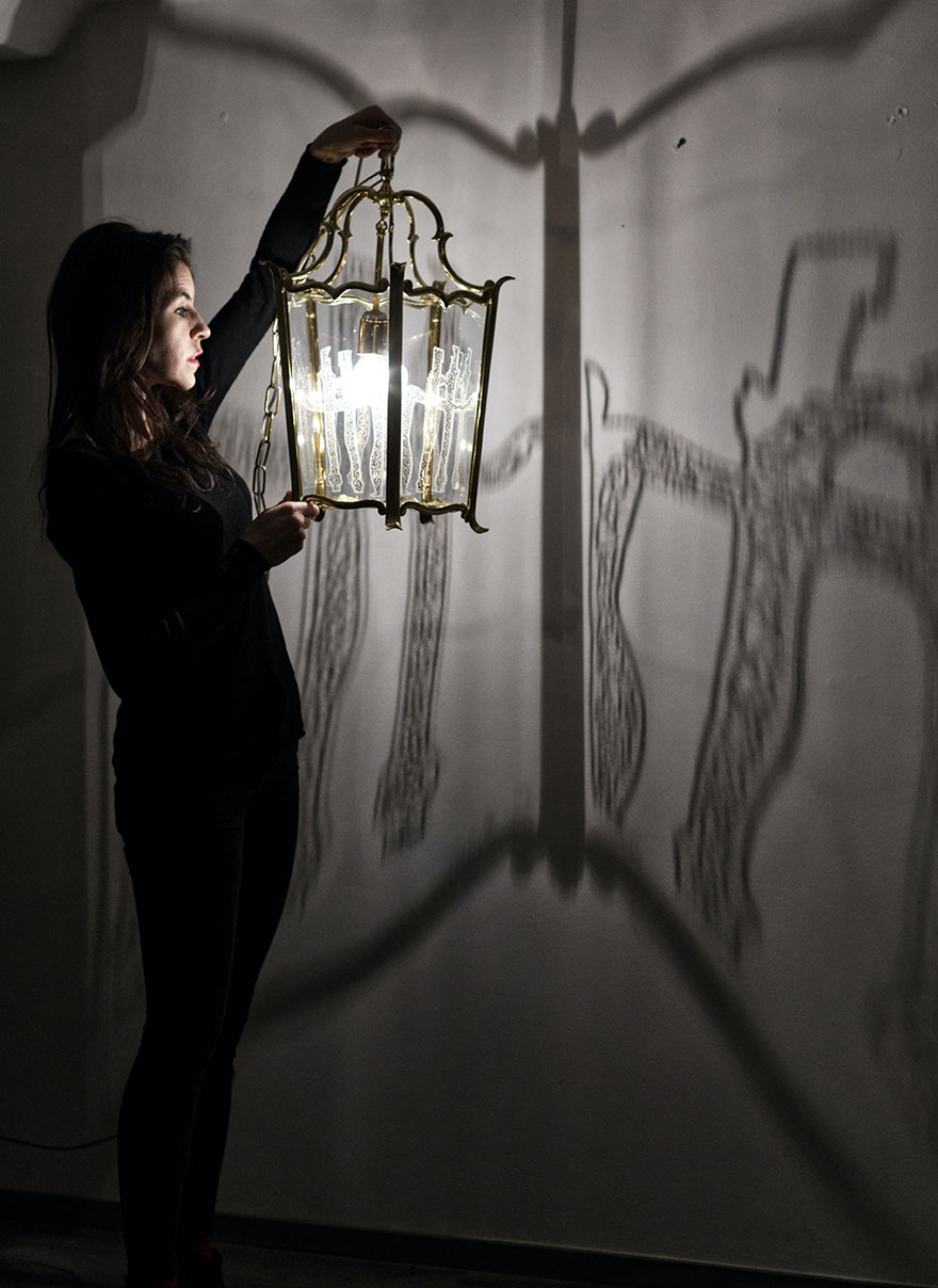 Eva Petrič with one of her LOBMEYR lanterns and its shadow